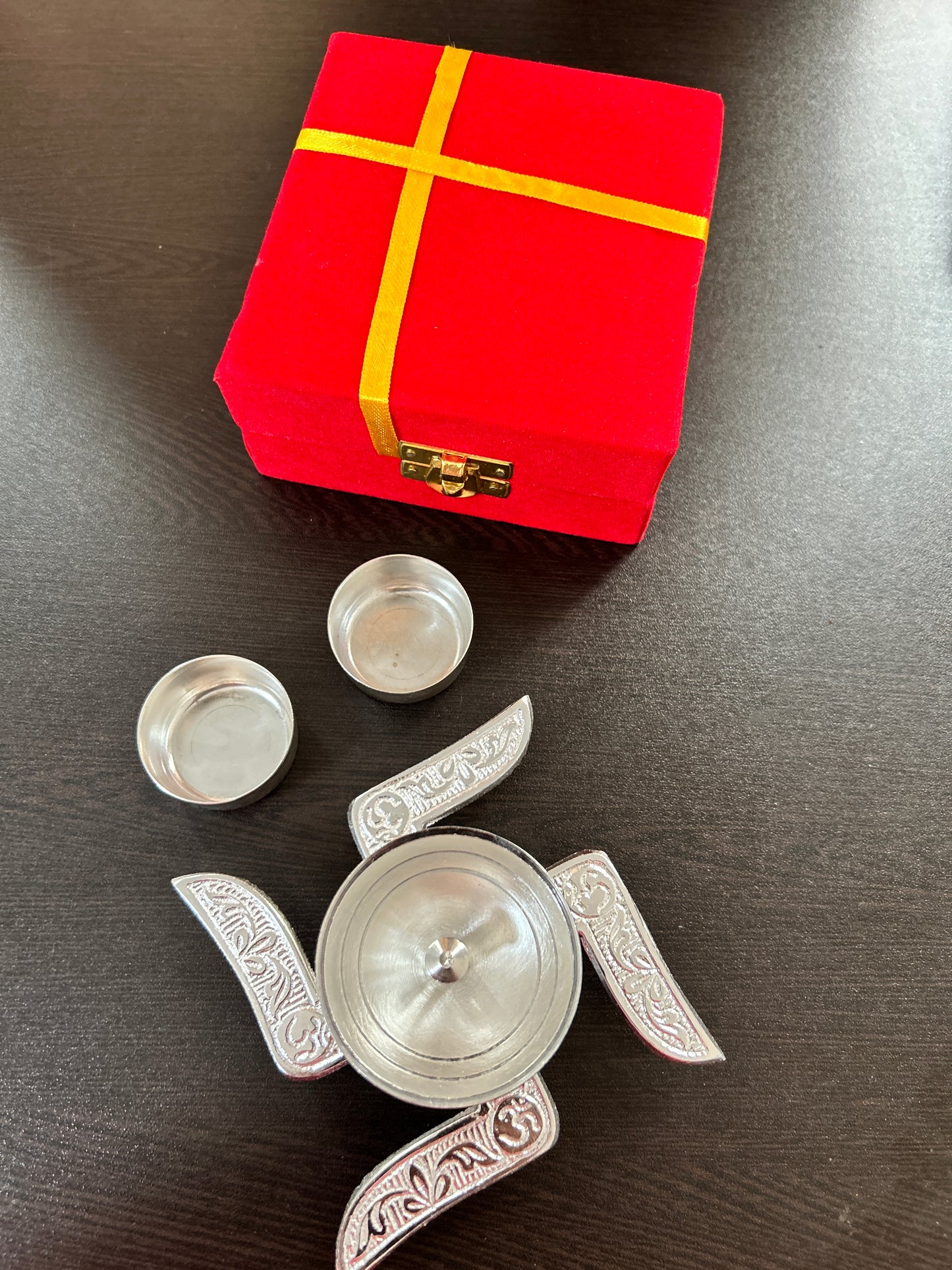 Swastik diya with haldi kumkum bowl