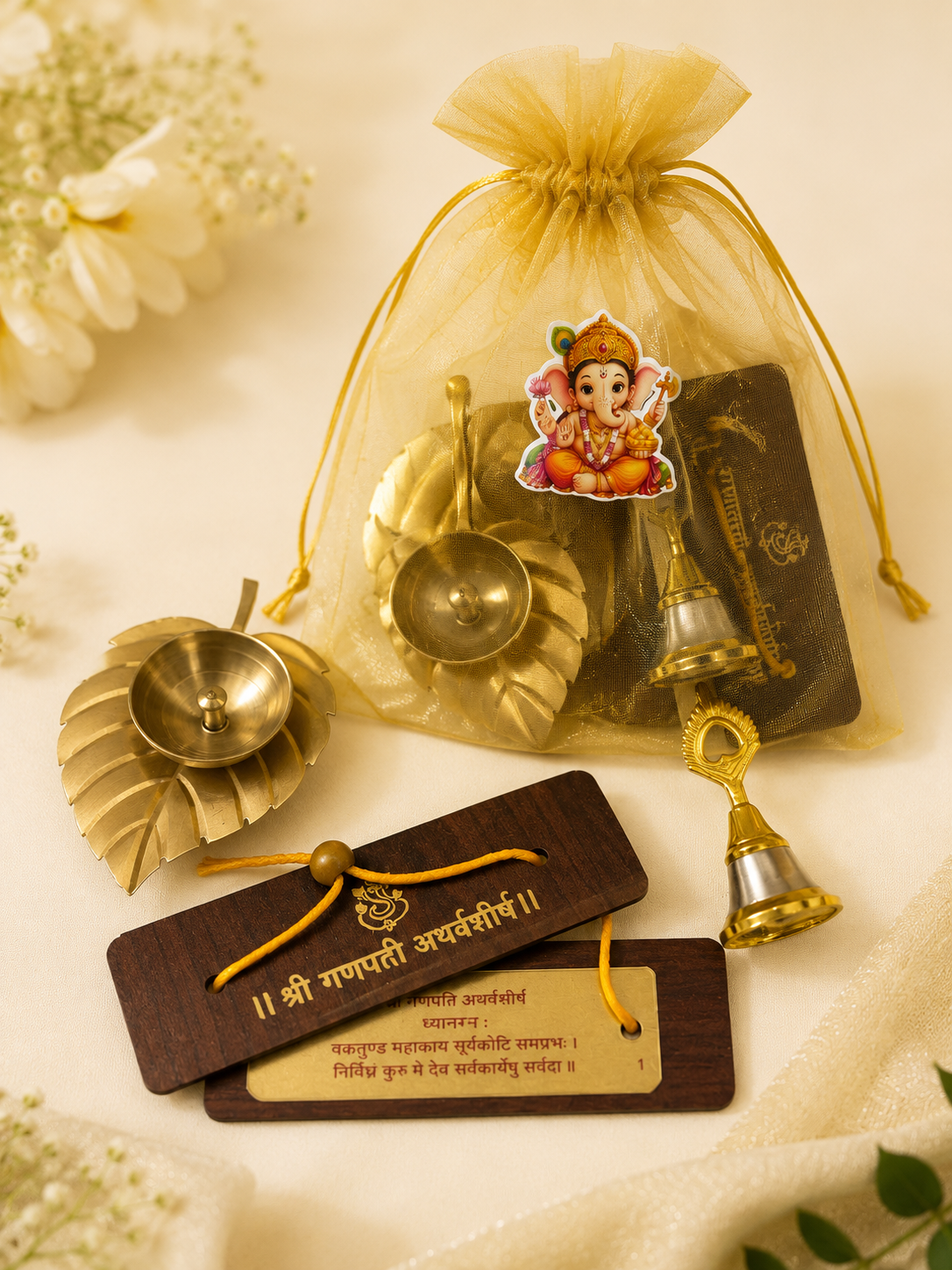 Ganpati Organza Potli Hamper | Brass Leaf Diya, Ganpati Atharvashirsh & Bell Gift Set