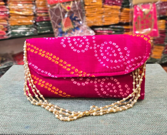 Bandhej sling clutch bag