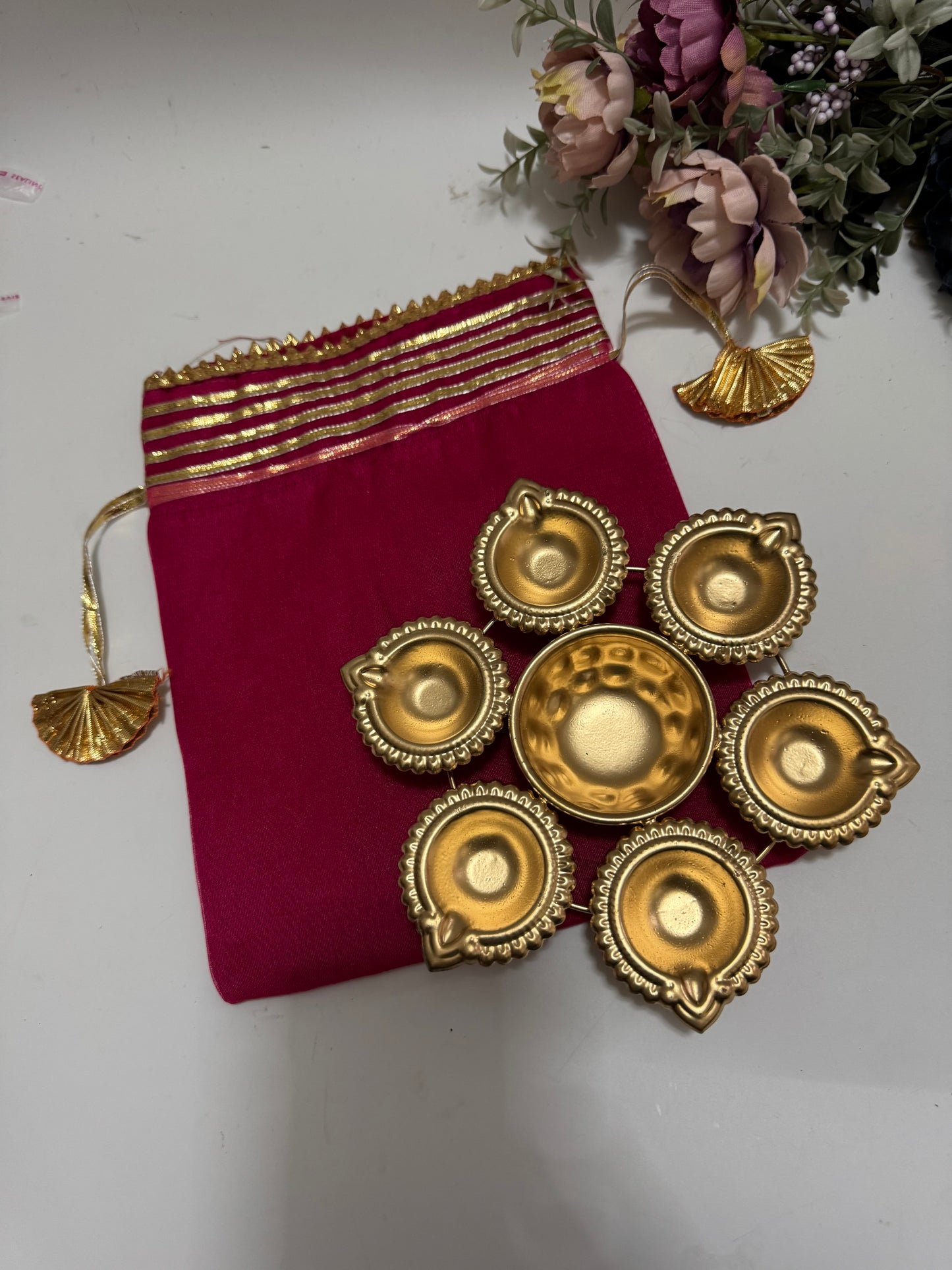 Brass Coated Urli with Double Organza Potli