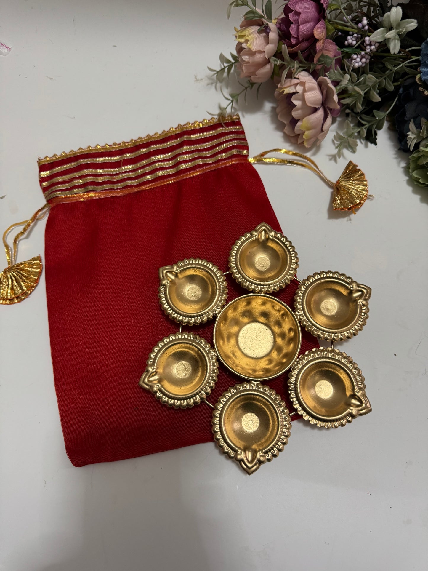 Brass Coated Urli with Double Organza Potli
