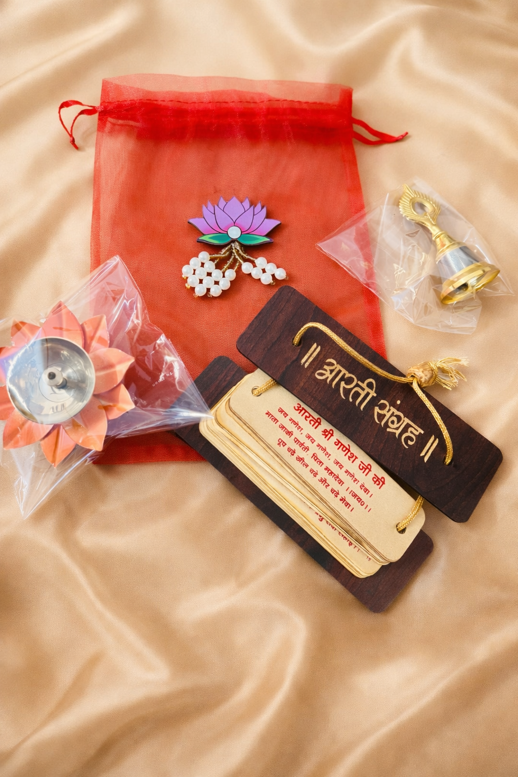 Lotus Pooja Return Gift Set | Organza Potli with Diya, Bell & Aarti Sangrah