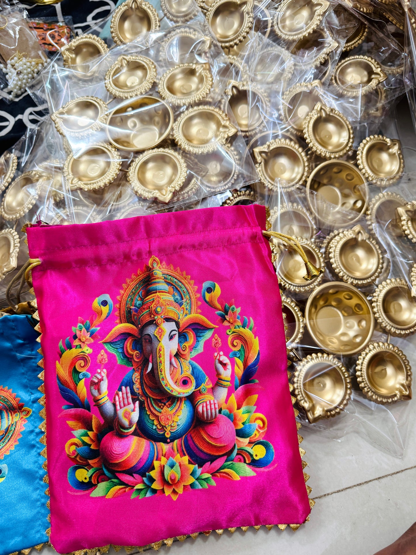 Metal urli with ganesh ji potli