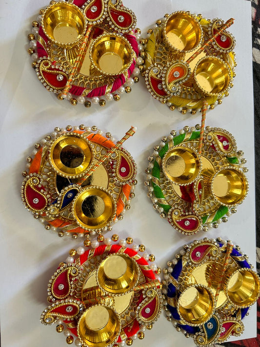 Vibrant tilak plate with tilak stick